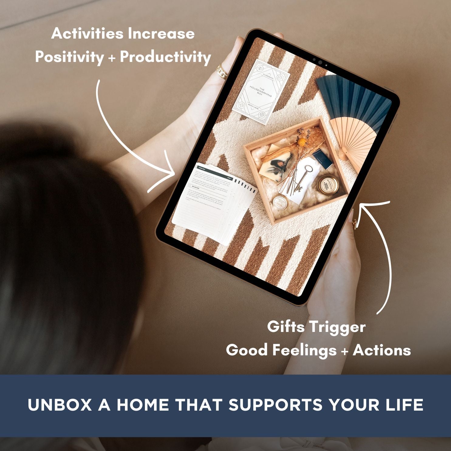 Digital tablet showing a photo of the housewarming box. Text "Activities Increase Positivity + Productivity", "Gifts Trigger Good Feelings + Action", "UNBOX A HOME THAT SUPPORTS YOUR LIFE."