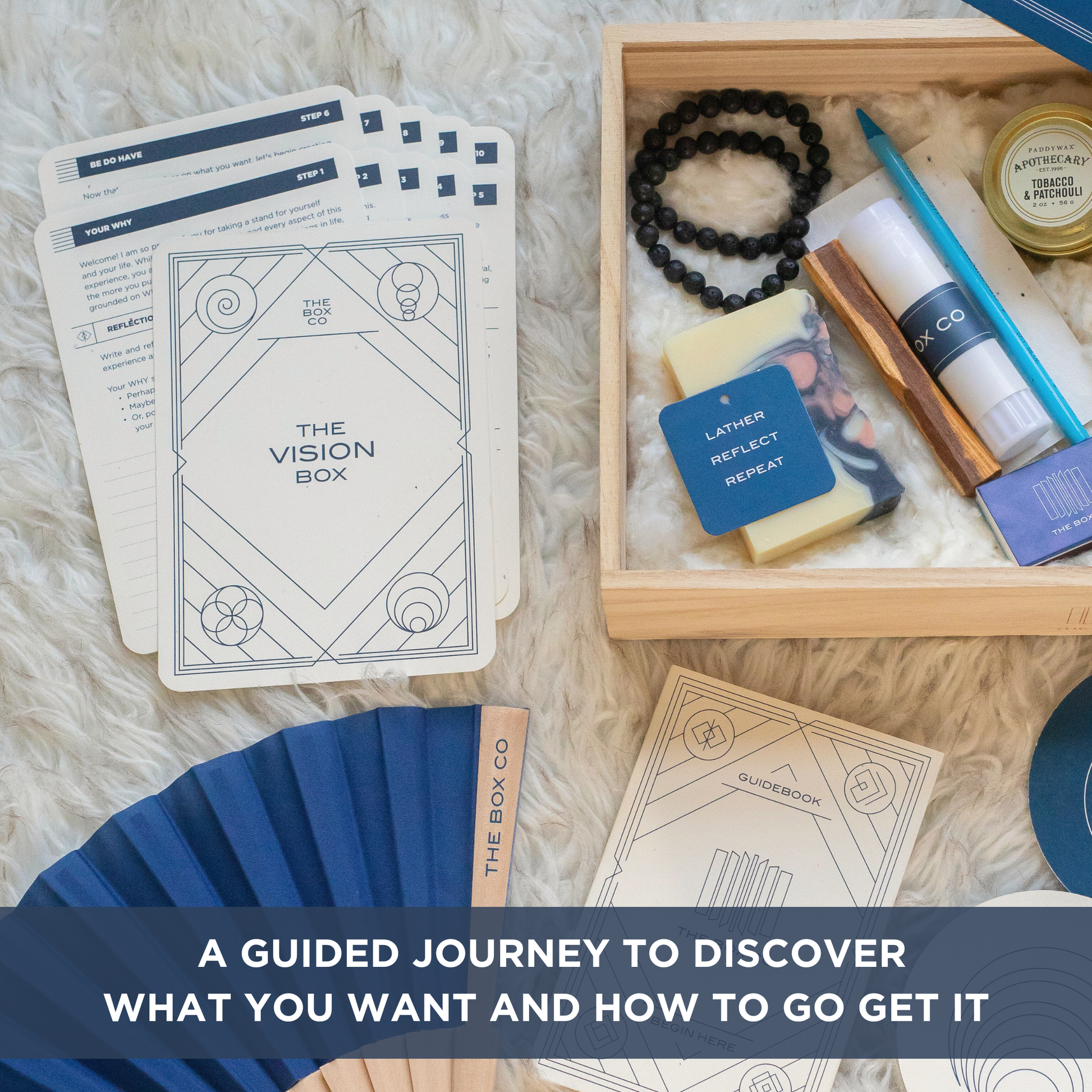 The Vision Box: cards laid out on a white rug next to o wooden box showing it's contents. Text overlay "A GUIDED JOURNEY TO DISCOVER WHAT YOU WANT AND HOW TO GET IT".