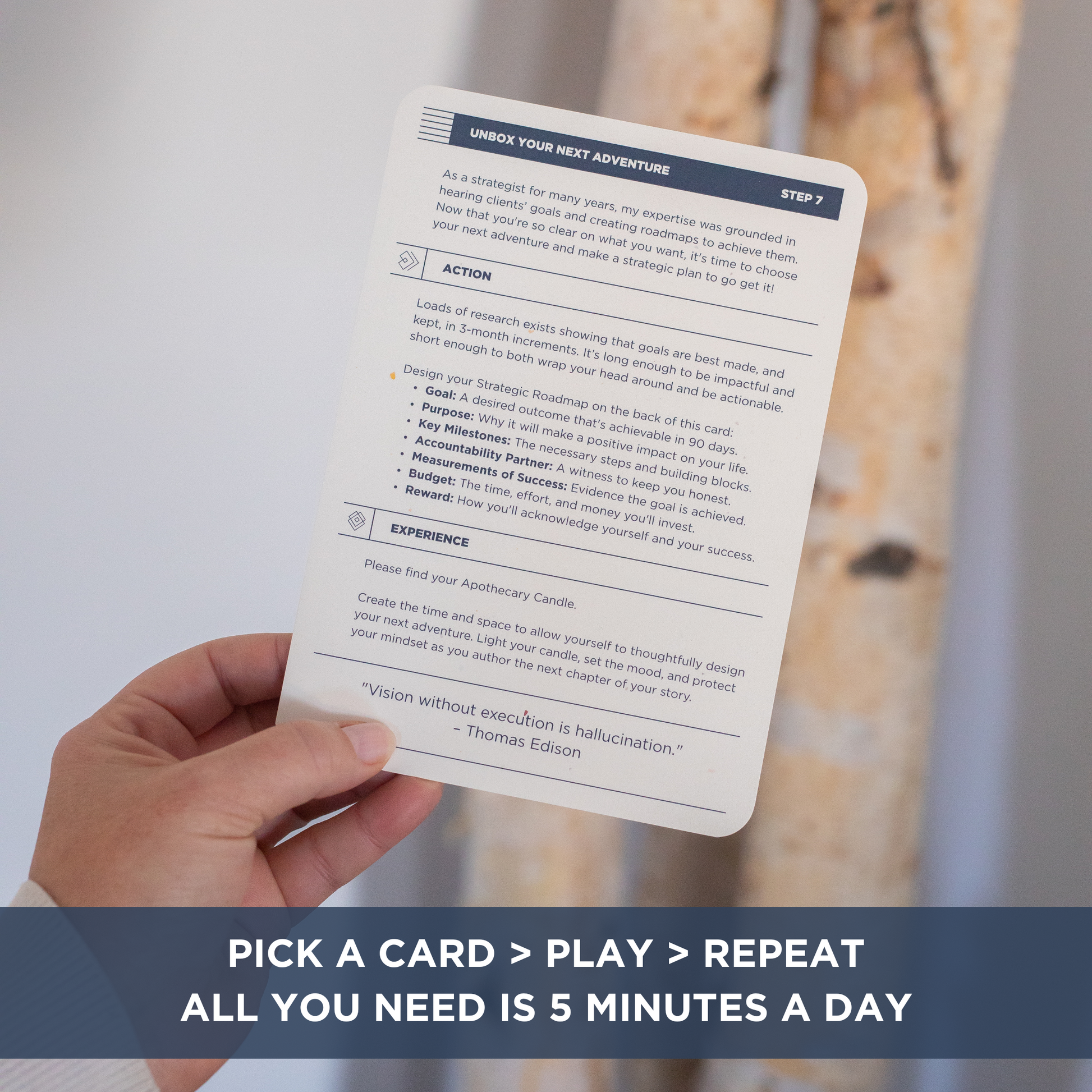 The Vision Box: hand holding an instruction card. Text overlay "PICK A CARD > PLAY > REPEAT. ALL YOU NEED IS 5 MINUTES A DAY".