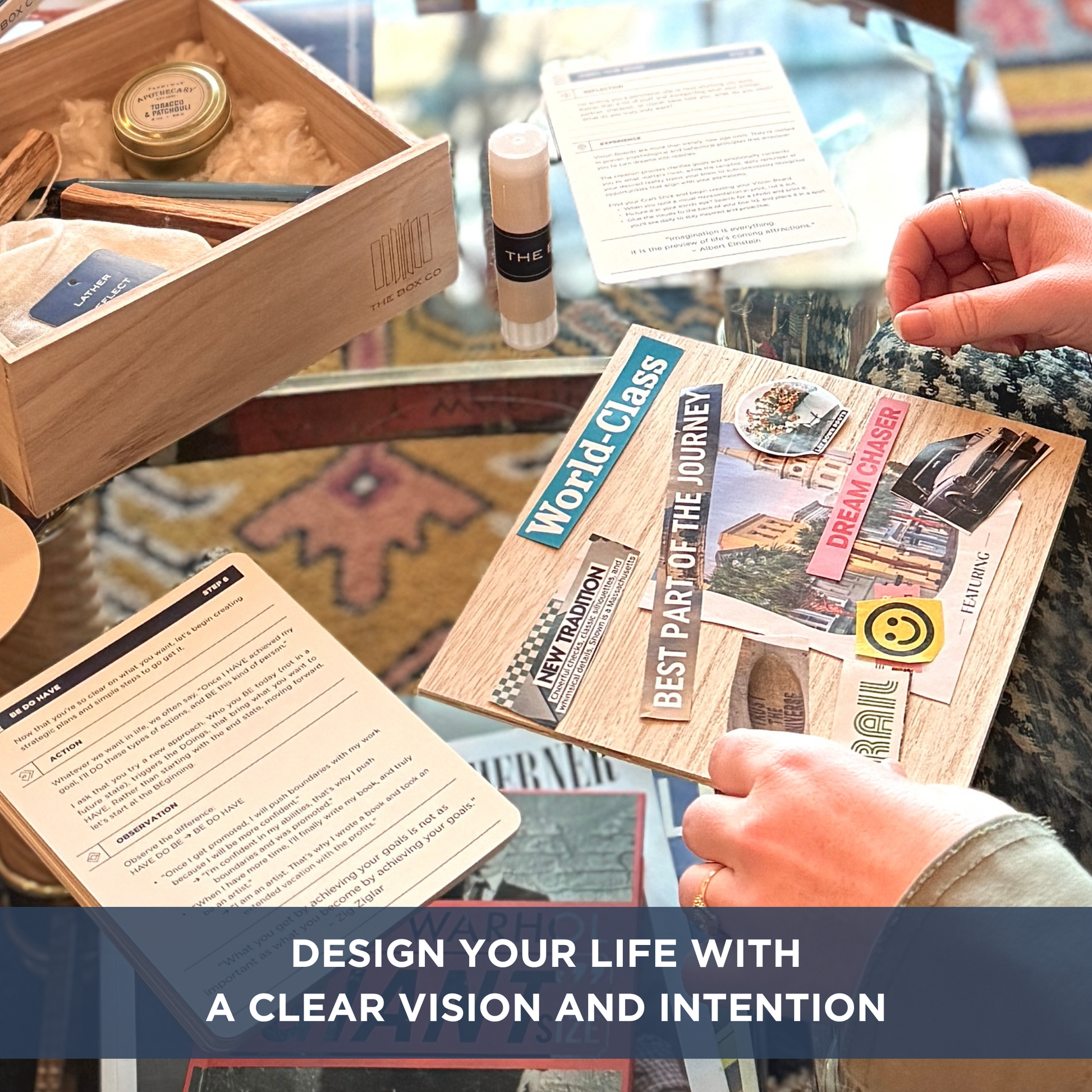 The Vision Box: glass table with wooden box, and a collage of vision board images cut out. Text overlay "DESIGN YOUR LIFE WITH A CLEAR VISION AND INTENTION".